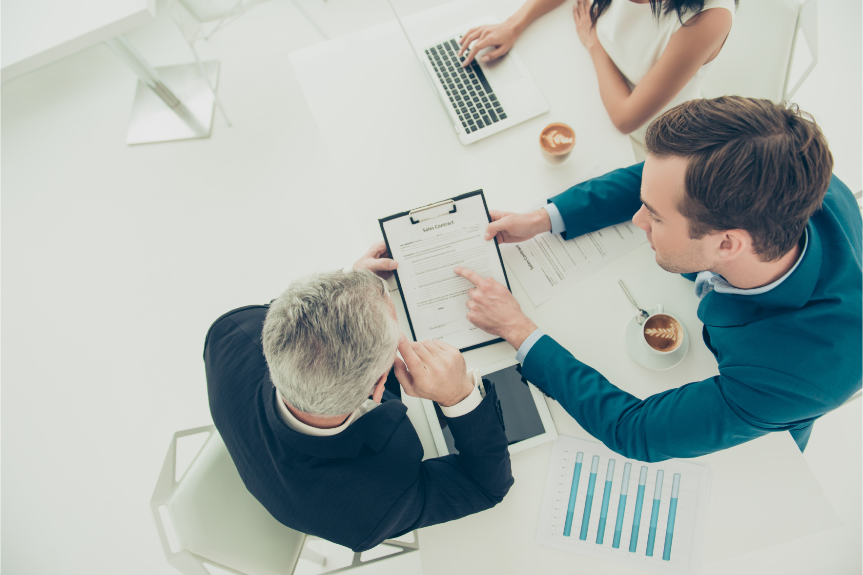 2 men reviewing document on clipboard