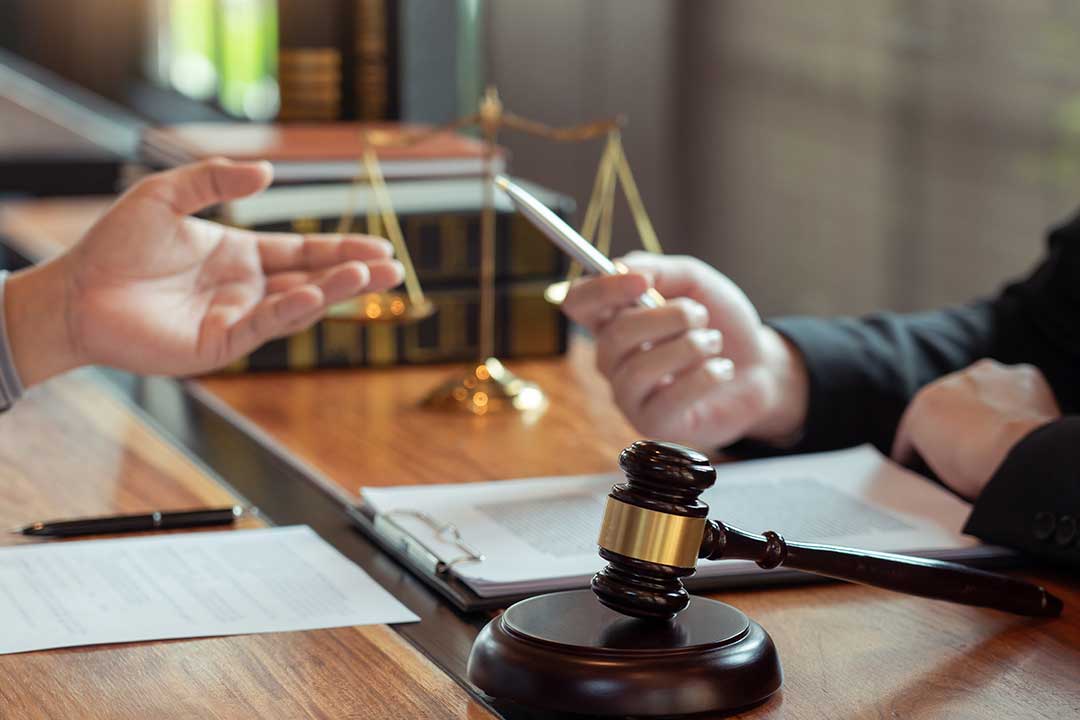 Attorney meeting with a client to provide guidance on a legal agreement