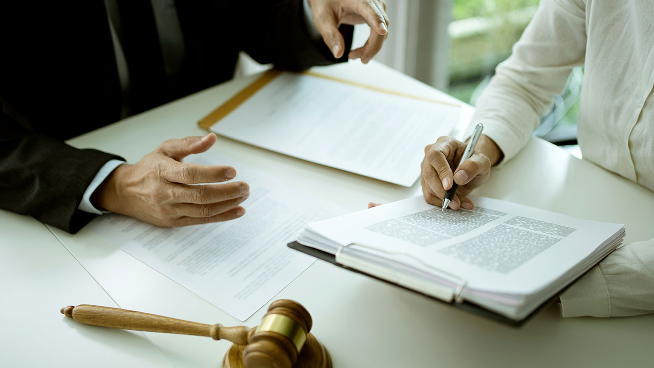 Business and commercial law. Lawyer meeting with executive to discuss upcoming case