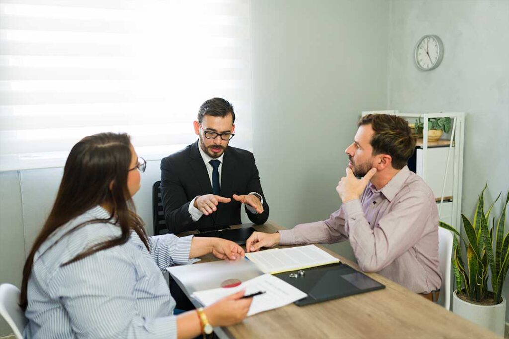 Family law attorney meeting with parents in a professional office setting