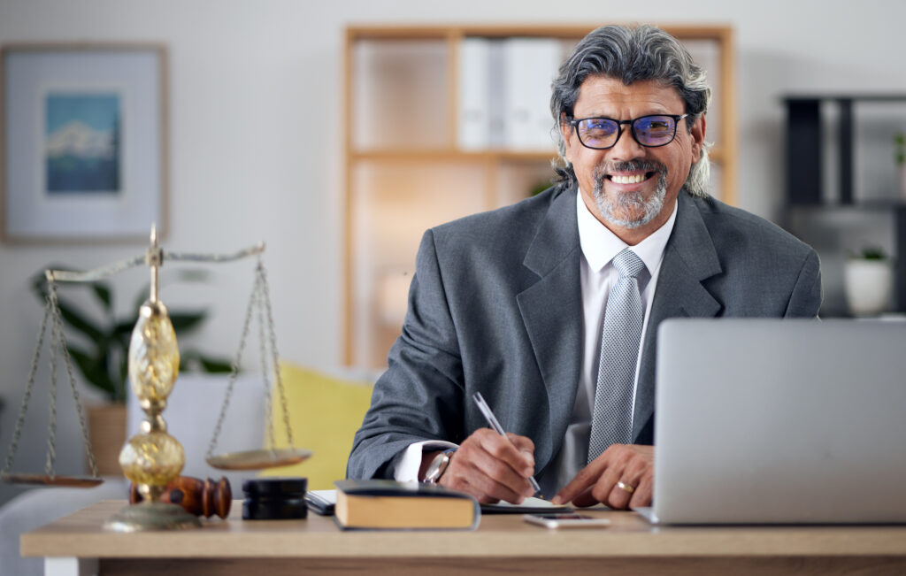 Justice, lawyer and portrait in office with laptop for working in law firm, court research or searc.