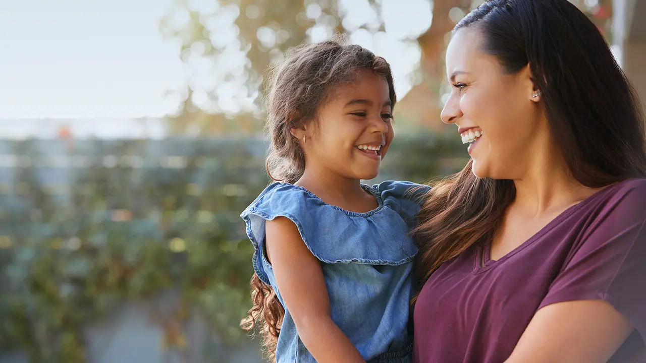 Mother and daughter smiling together representing family unity and compassion – Heymann Fletcher Family Law Attorneys