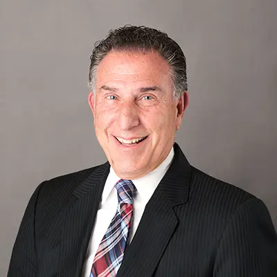 Corporate portrait of an experienced family law and divorce attorney in a suit at Heymann & Fletcher law firm